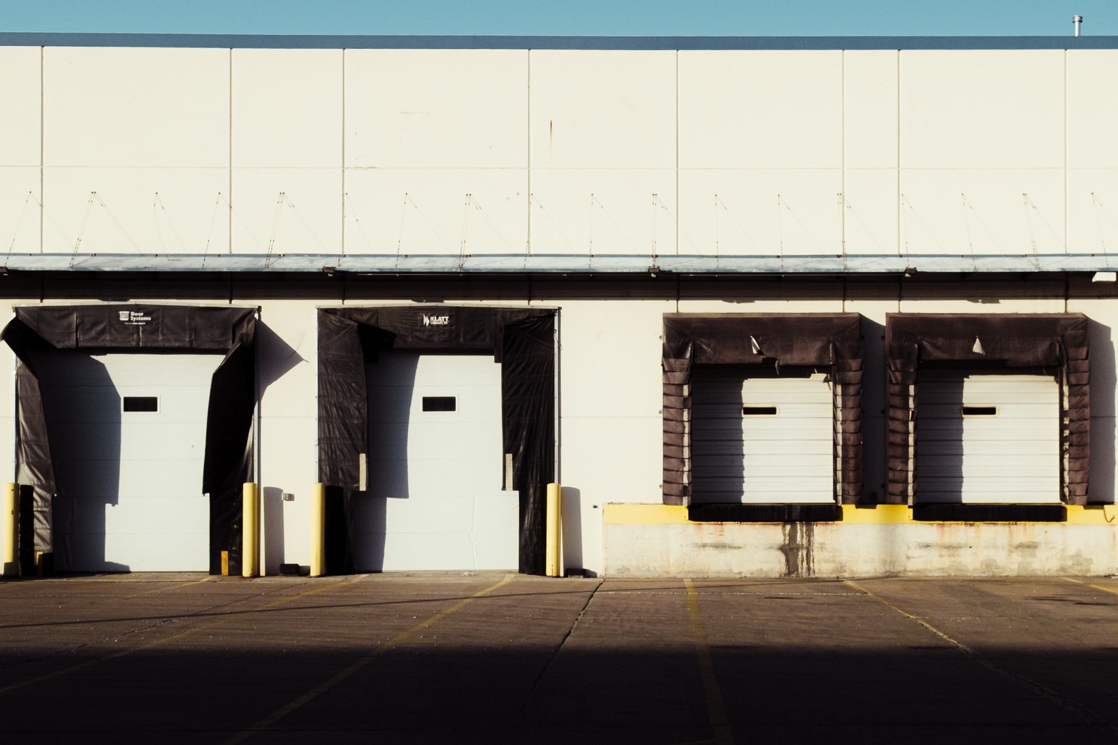 Industrial warehouse exterior with multiple loading docks
